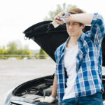 Mobile wrong fuel recovery van assisting a driver on the M25 motorway in South East England.