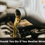 pouring fuel into car engine representing wrong fuel mistake and need for fuel drain service UK